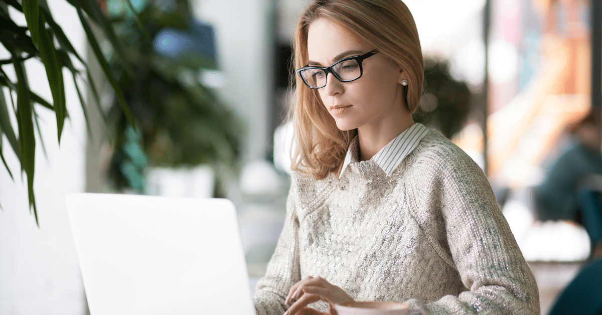 Business woman looking at her computer