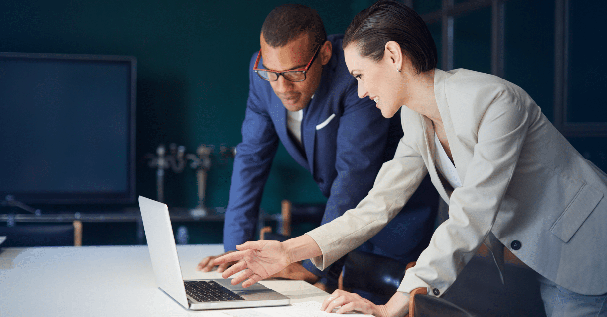 Business people looking at a computer screen