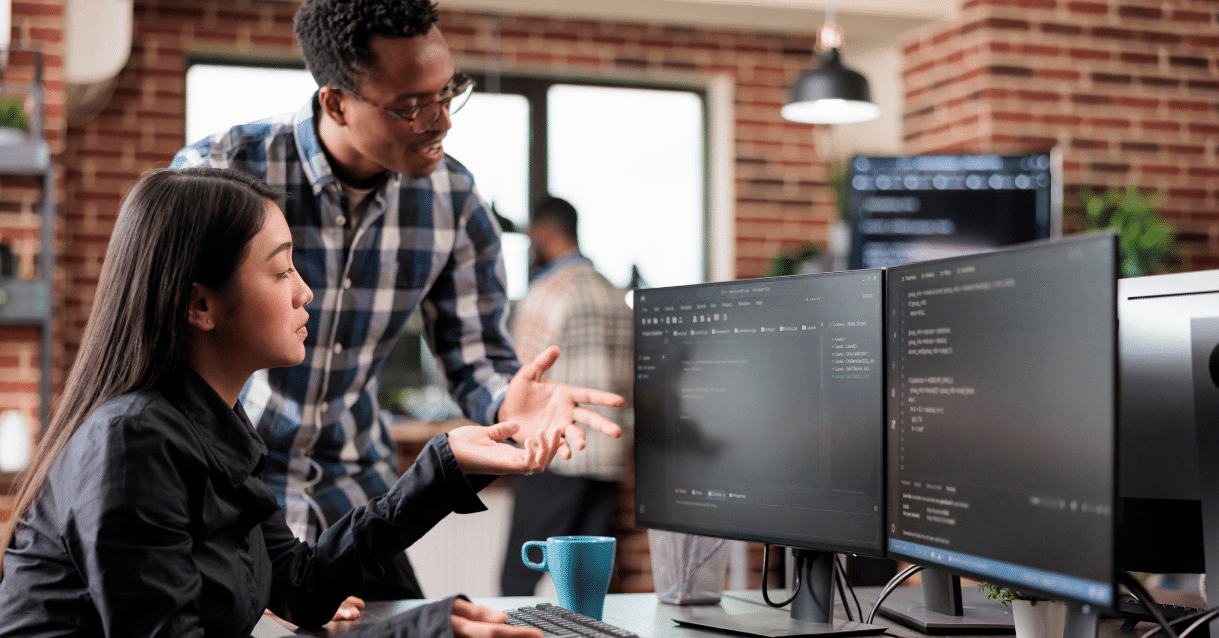 Business people looking at computer screens
