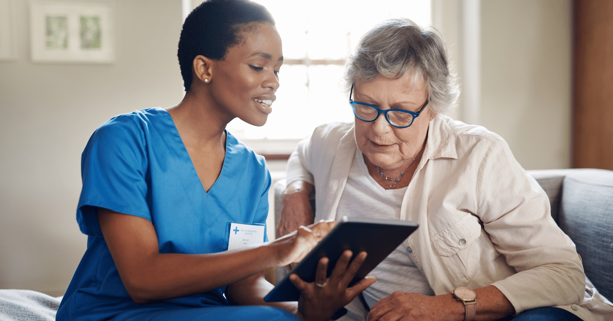 Healthcare provider and patient looking at a tablet