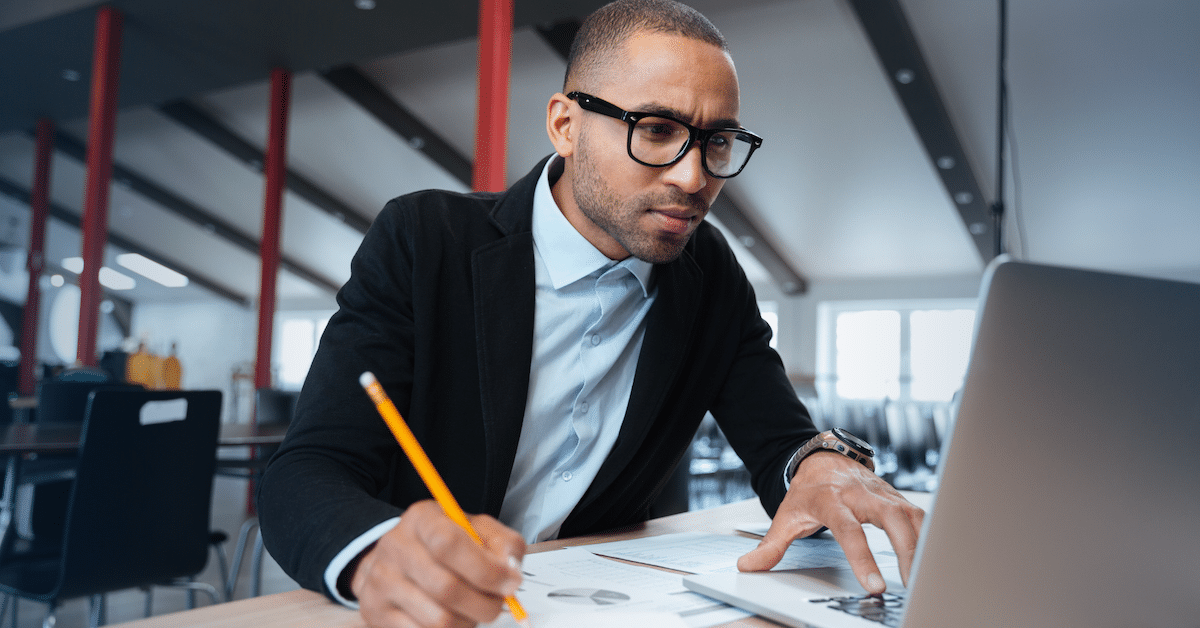 Man looking intently at his computer screen