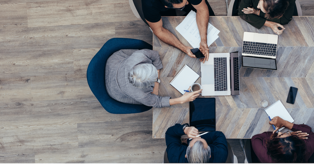 Overhead shot of multiple people looking at computers