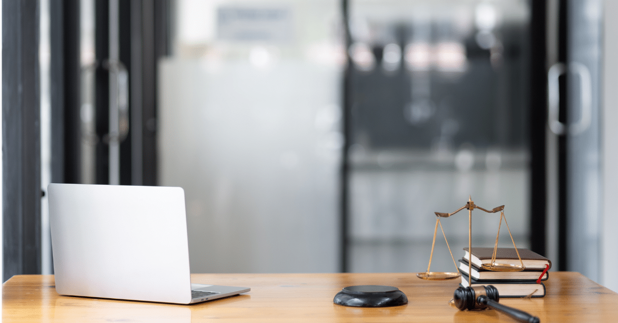 Computer and legal gavel on a desk